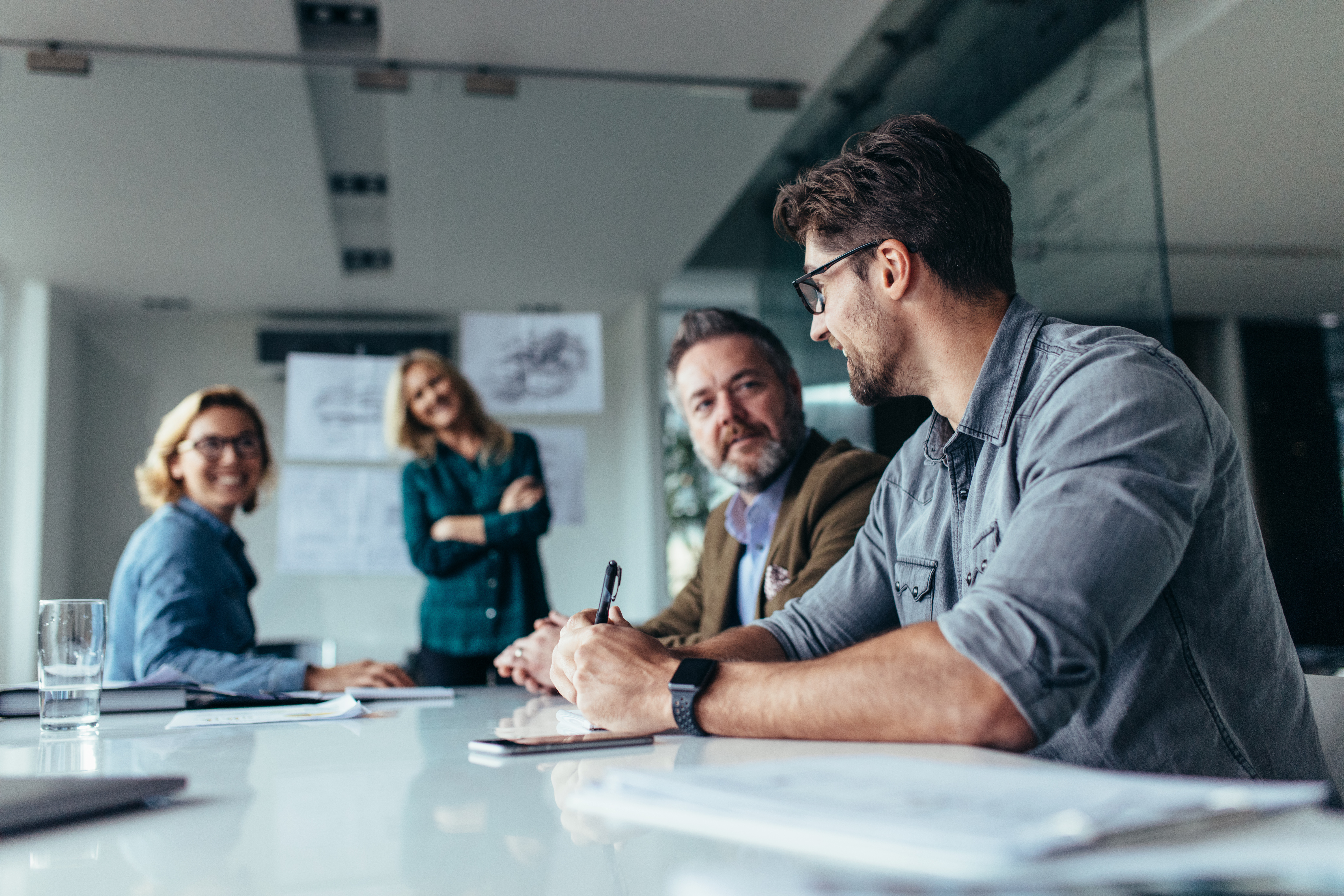 Businessman sharing ideas on project to team