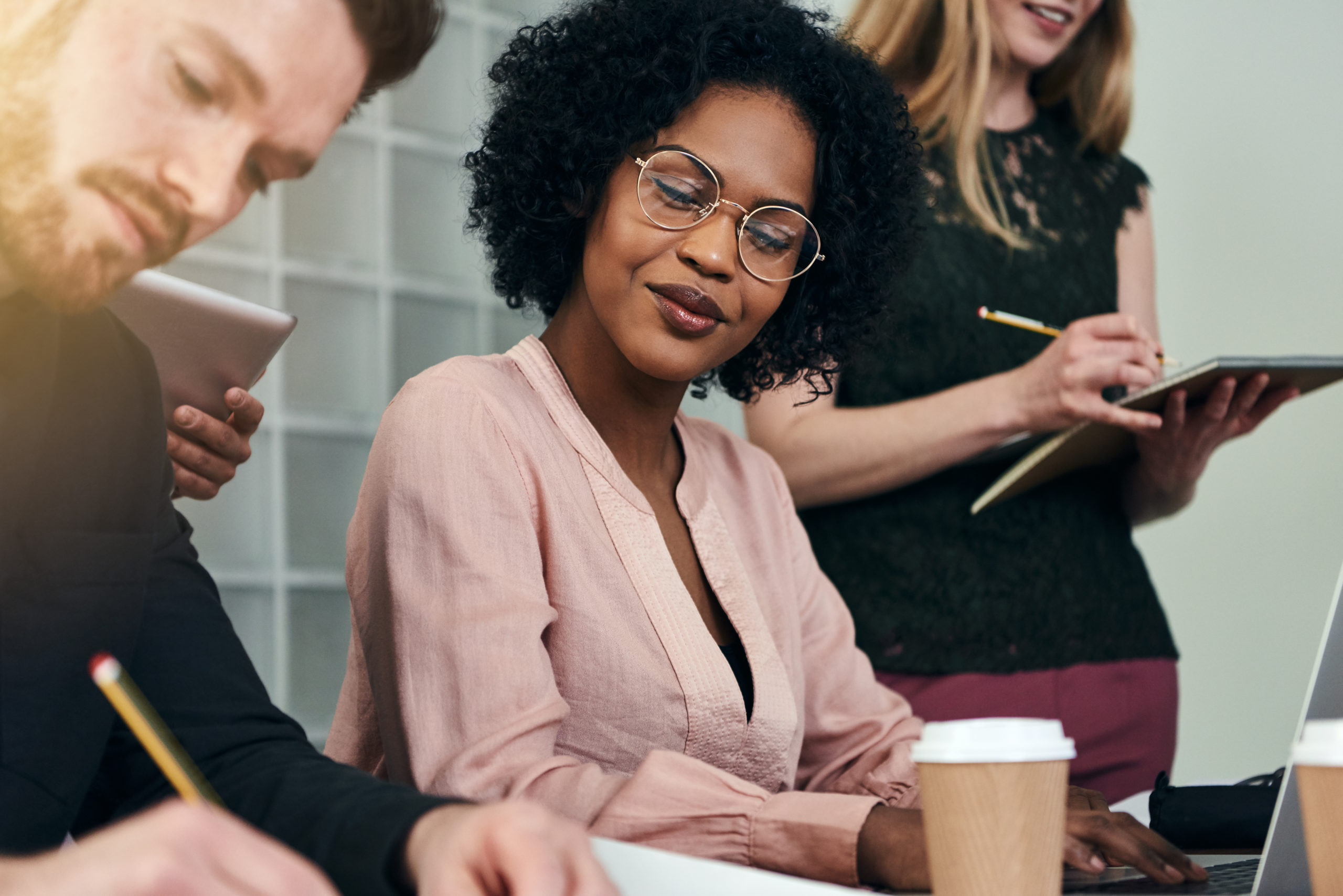 Diverse group of colleagues working together in an office